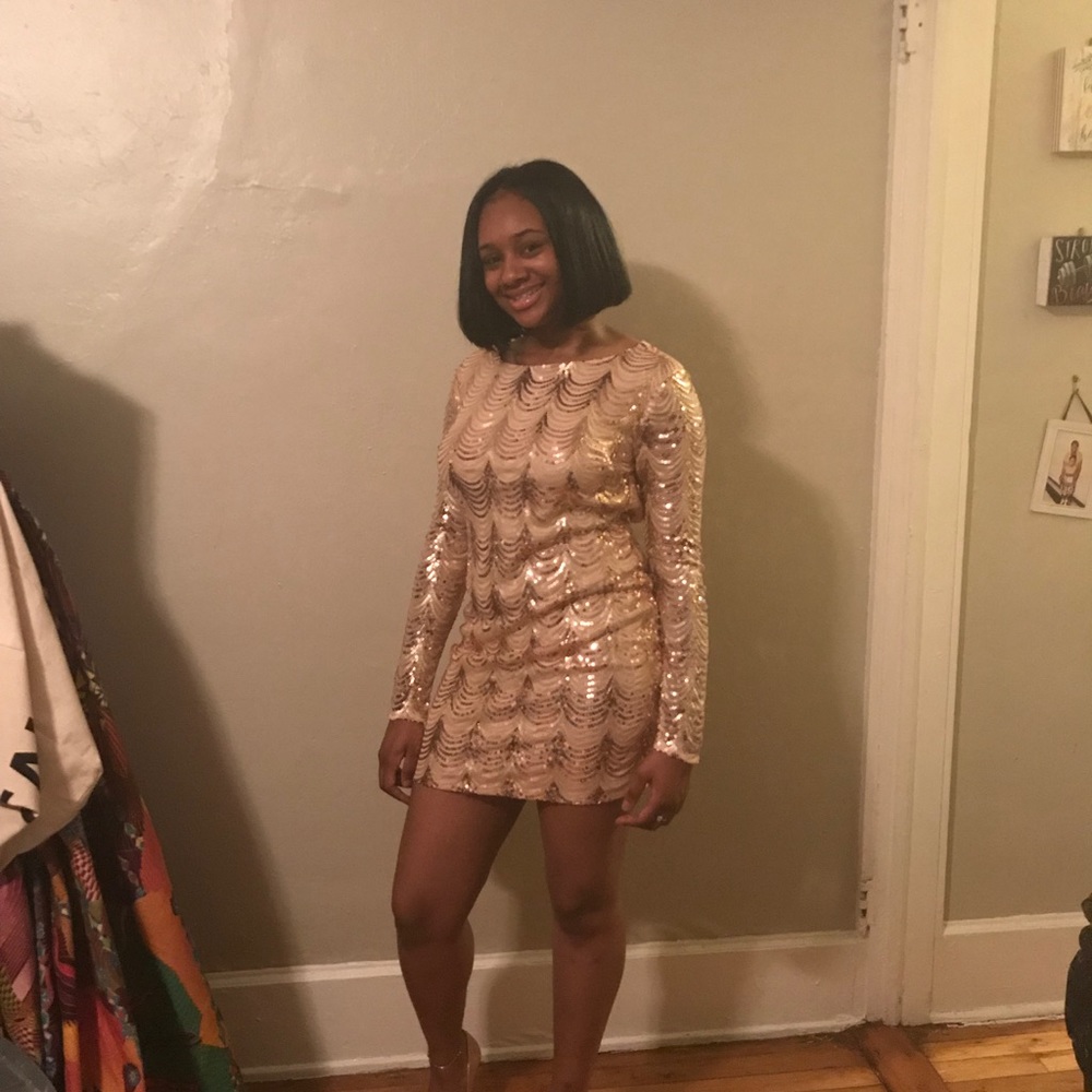 Gold sequin open back mini dress.
